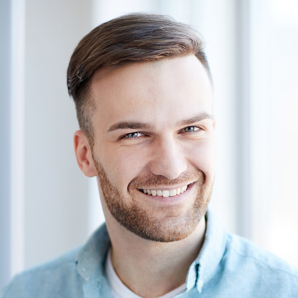 portrait-of-handsome-man-by-window-Q7G956M.jpg